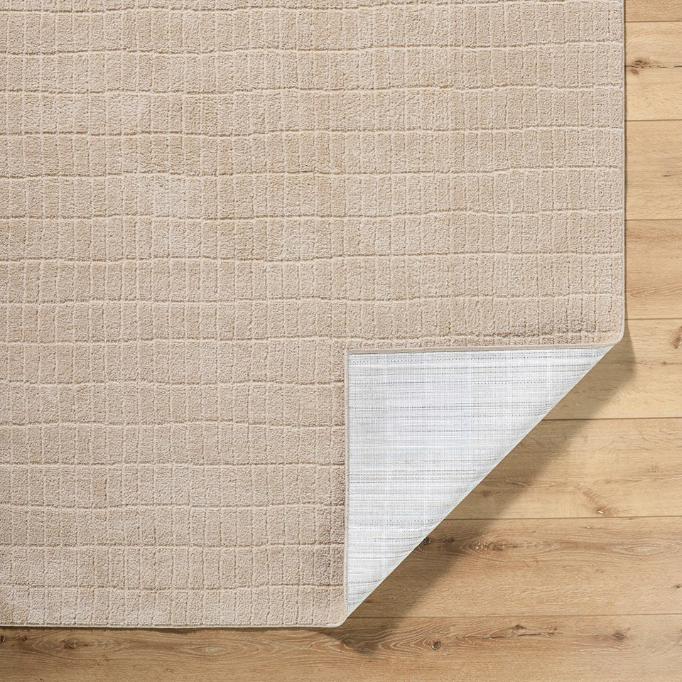 beige rug corner fold on wood floor