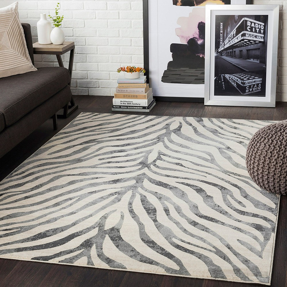charcoal zebra pattern rug in a room with matching decor