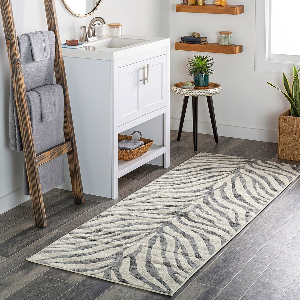 charcoal zebra pattern rug in a room with matching decor