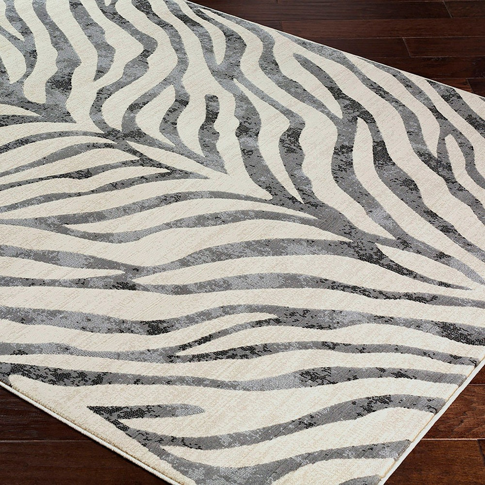 charcoal zebra pattern rug in a room with matching decor