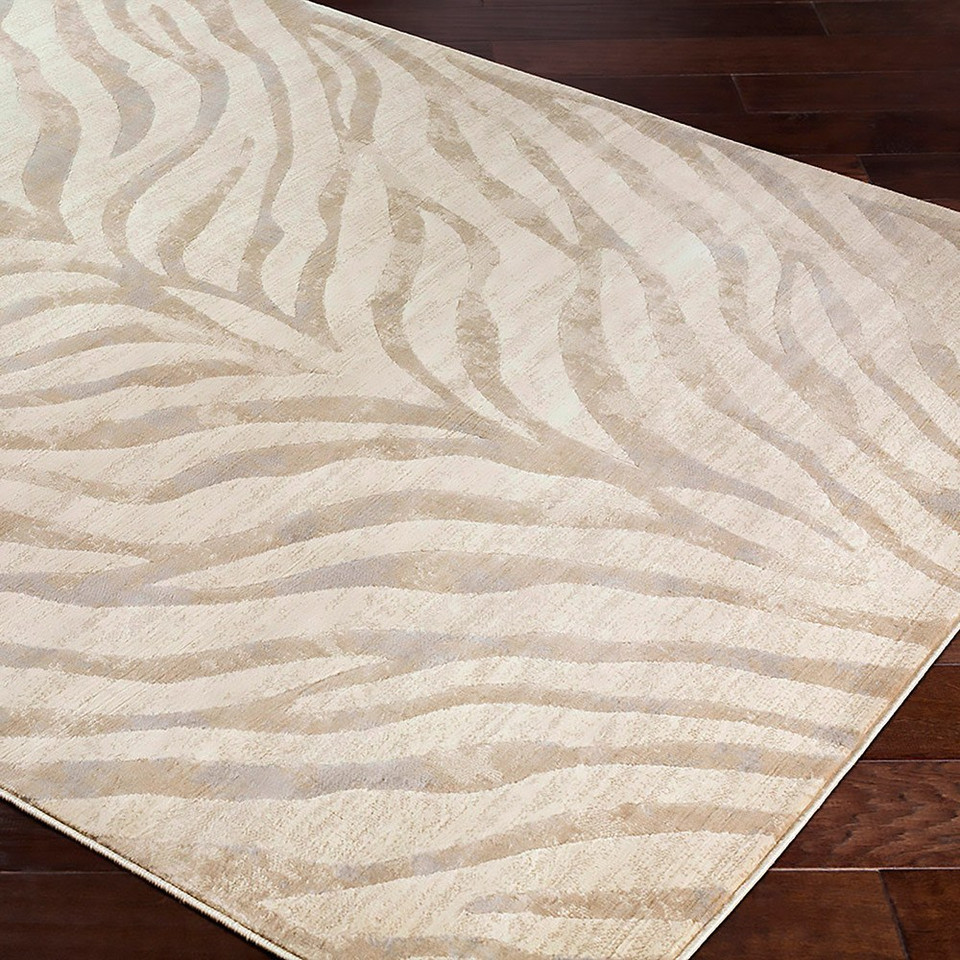 grey zebra pattern rug closeup corner on a wood floor