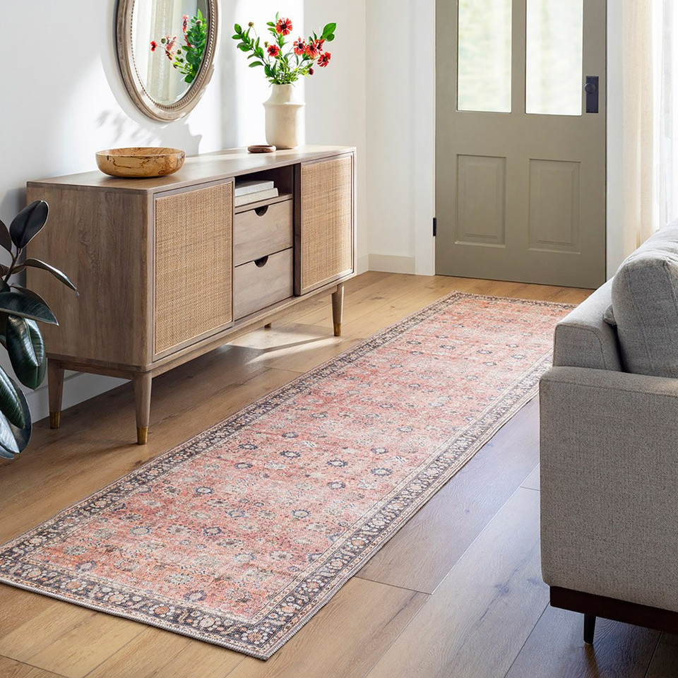 orange traditional rug in a room with matching decor