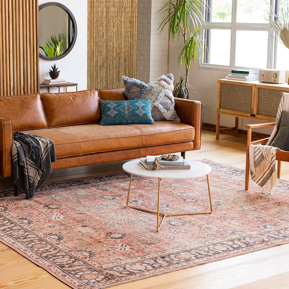 orange traditional rug in a room with matching decor