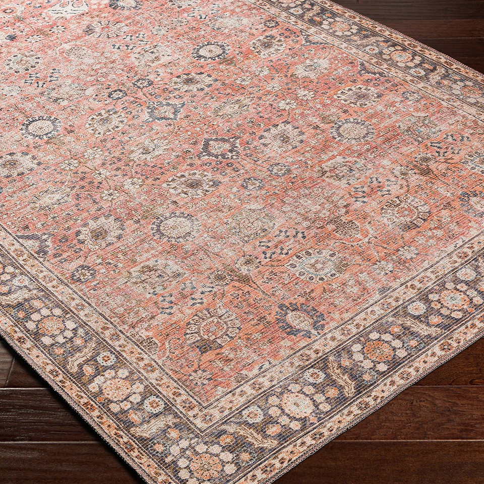orange traditional rug closeup corner on wood floor