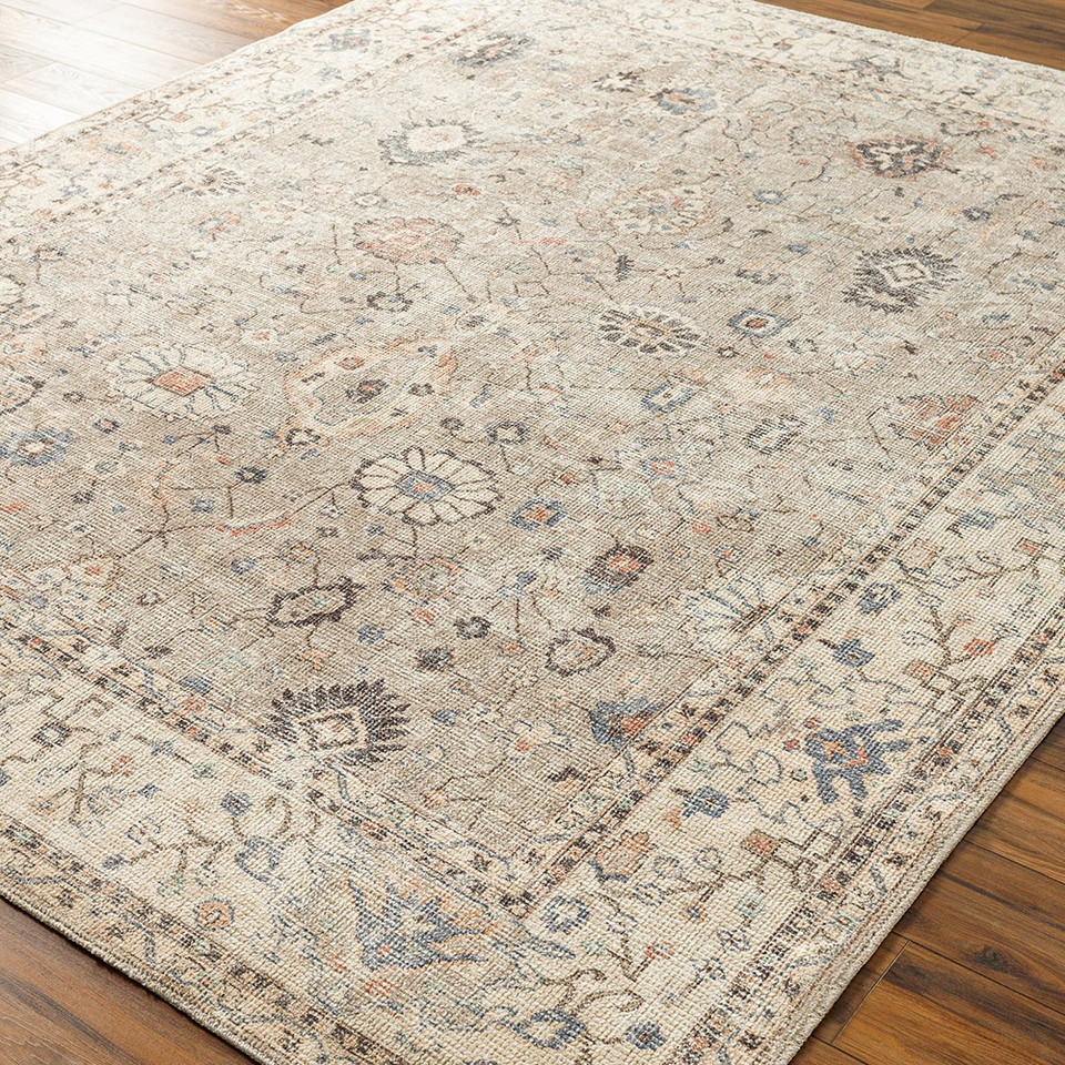 camel traditional rug in a room with matching decor