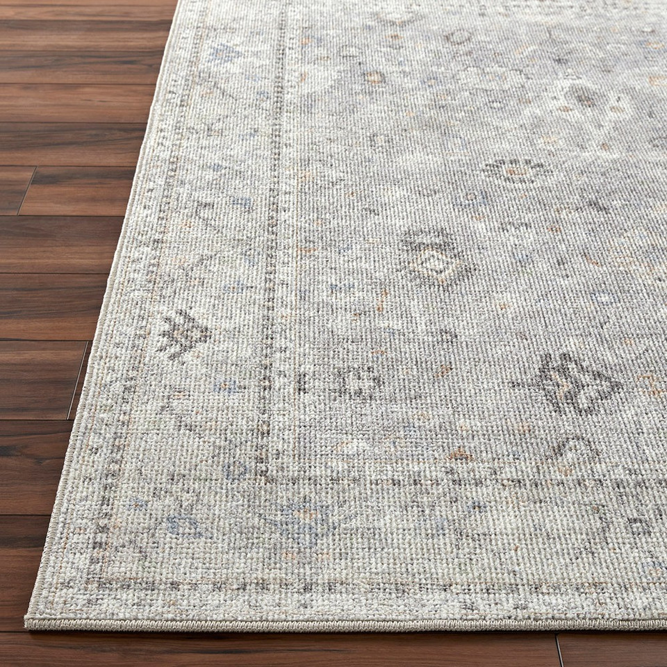 grey traditional rug closeup corner on wood floor