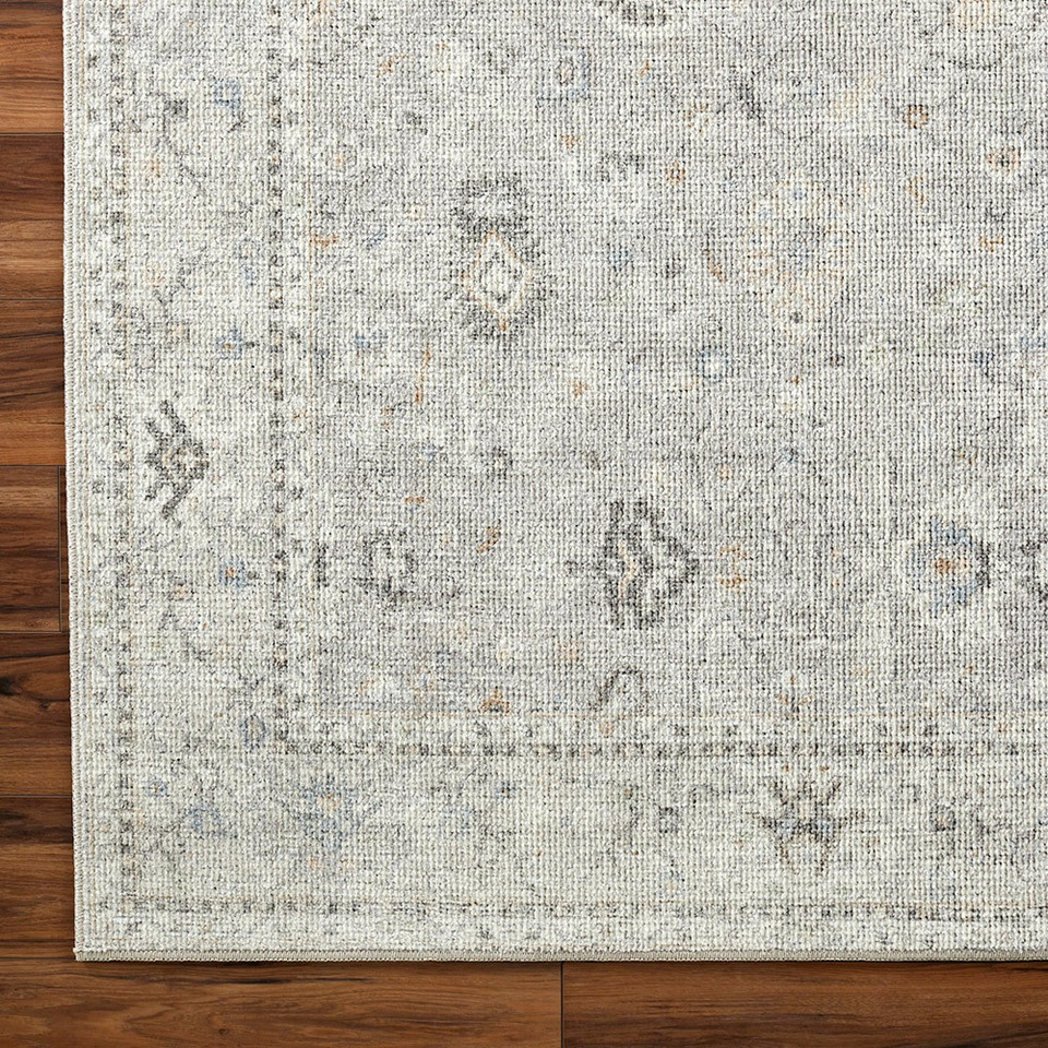grey traditional rug closeup corner on wood floor