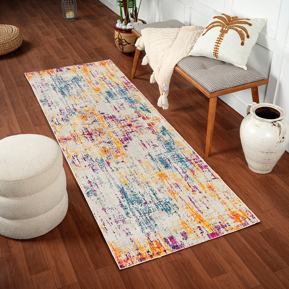 multicolour abstract rug in a room with matching decor
