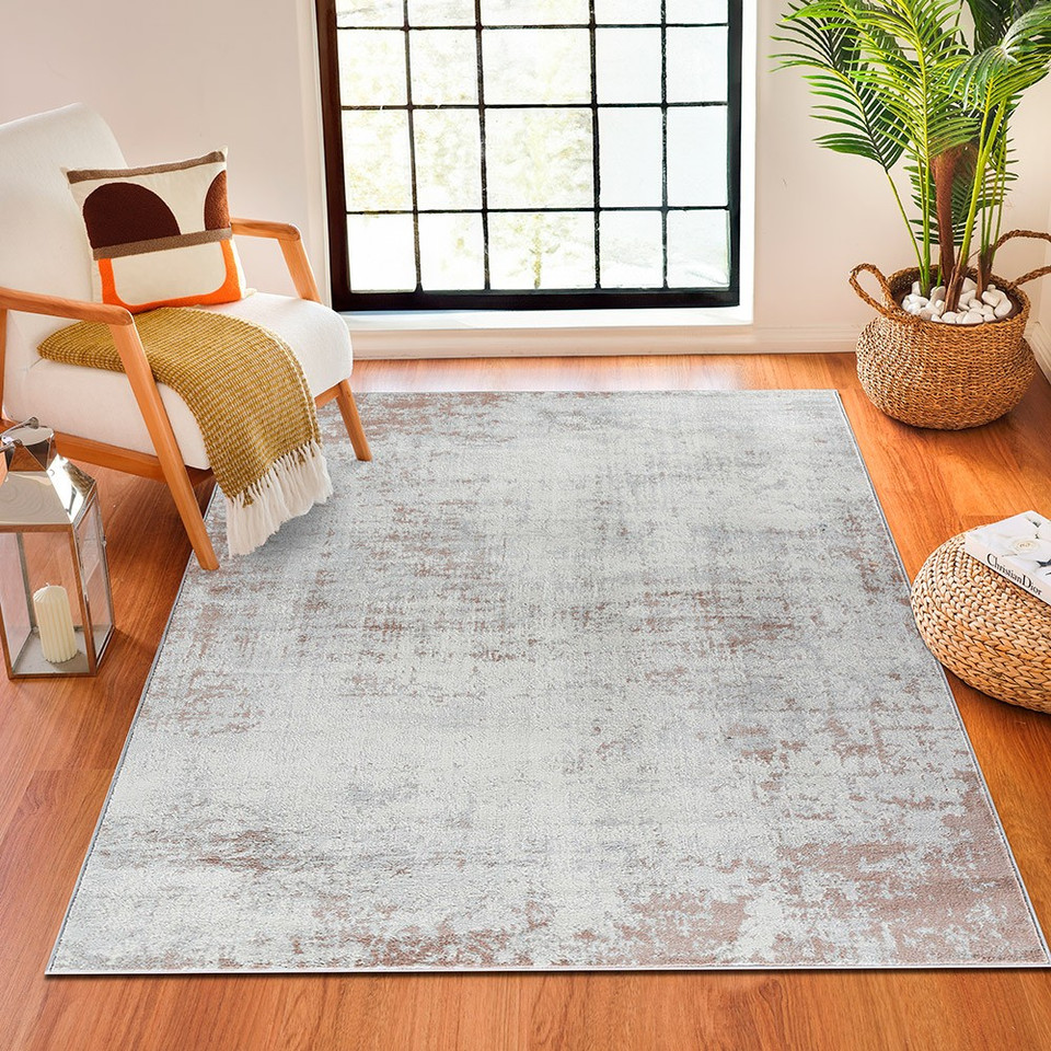 grey abstract rug in a room with matching decor