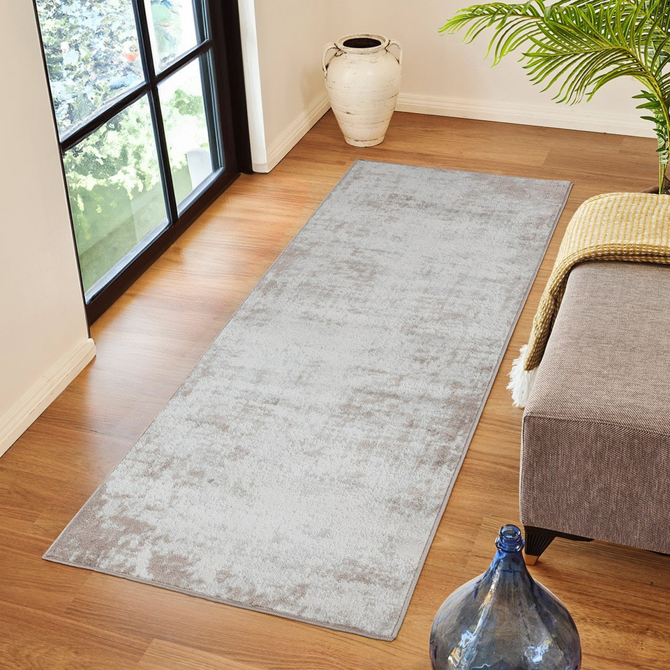 grey abstract rug in a room with matching decor