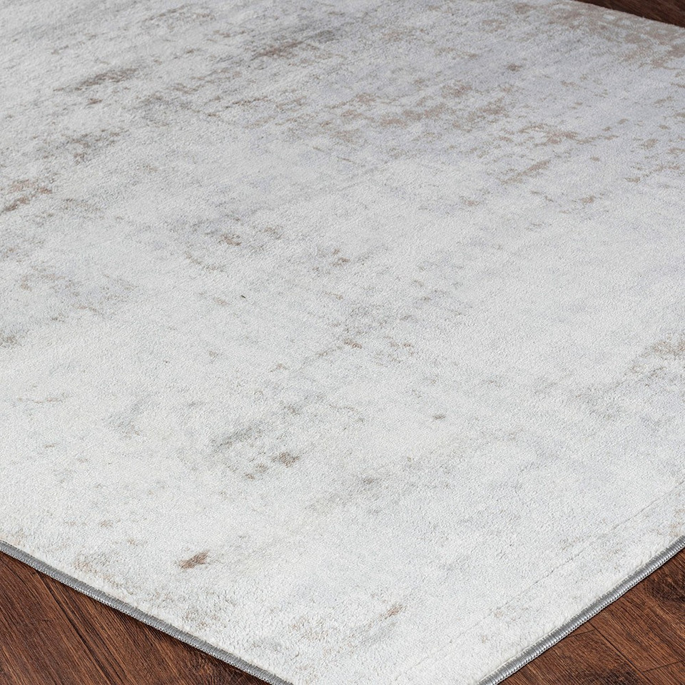 grey abstract rug closeup corner on wood floor