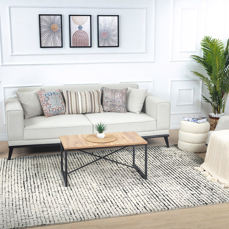 ivory black scandi rug in a room with matching decor