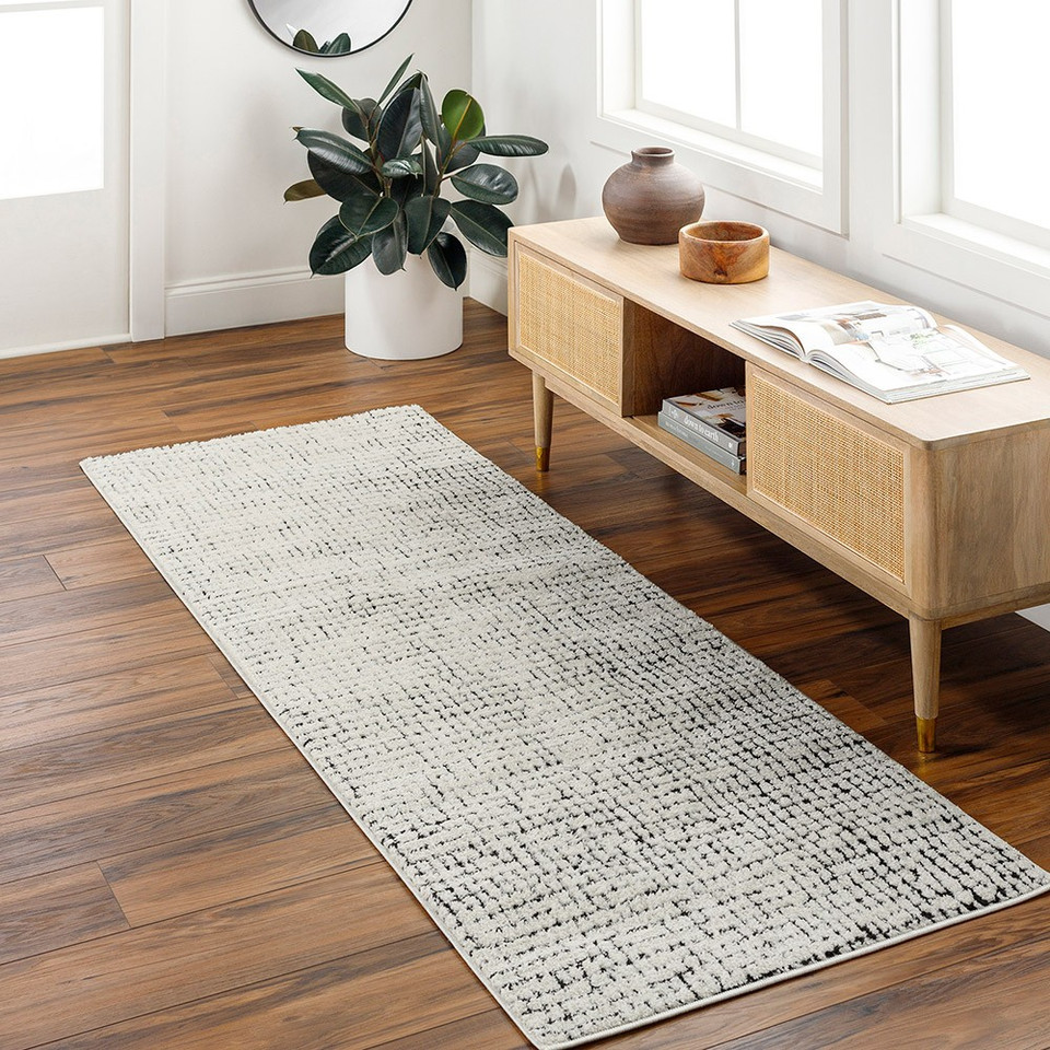 ivory black scandi rug in a room with matching decor