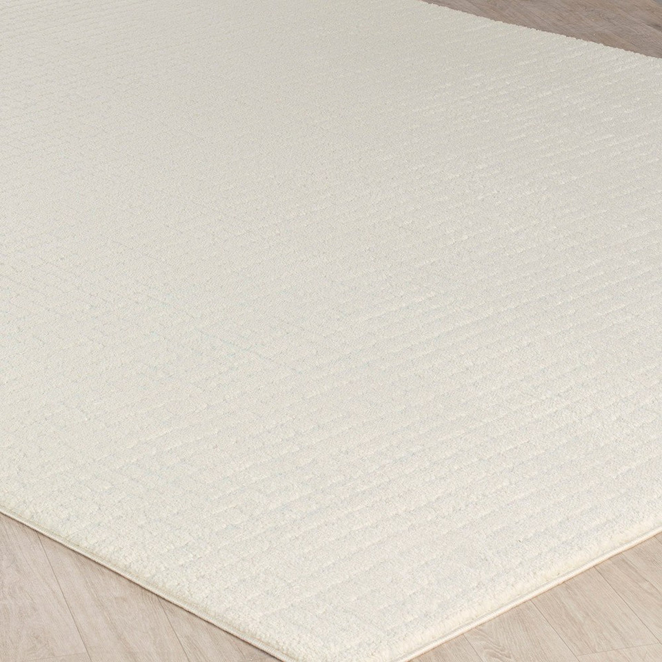 ivory off-white scandi rug closeup corner on wood floor