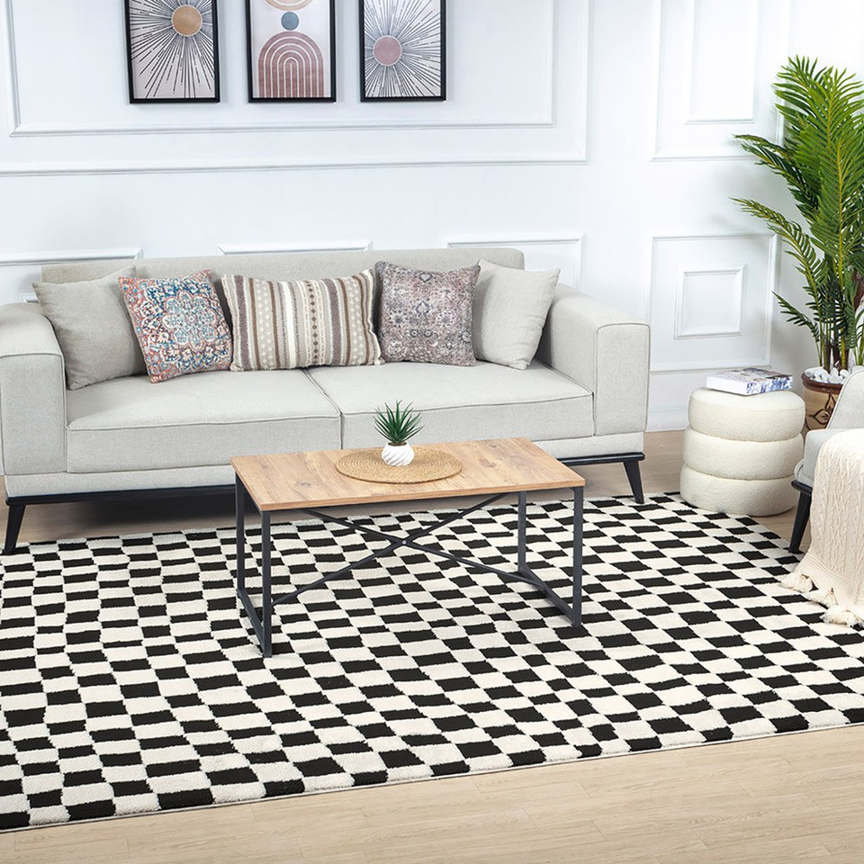 ivory black scandi rug in a room with matching decor