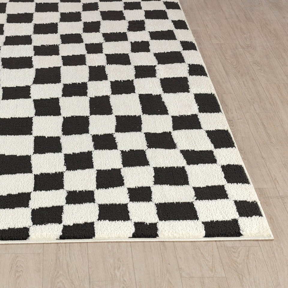 ivory black scandi rug closeup corner on wood floor