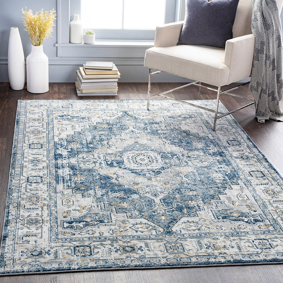 blue traditional rug in a room with matching decor