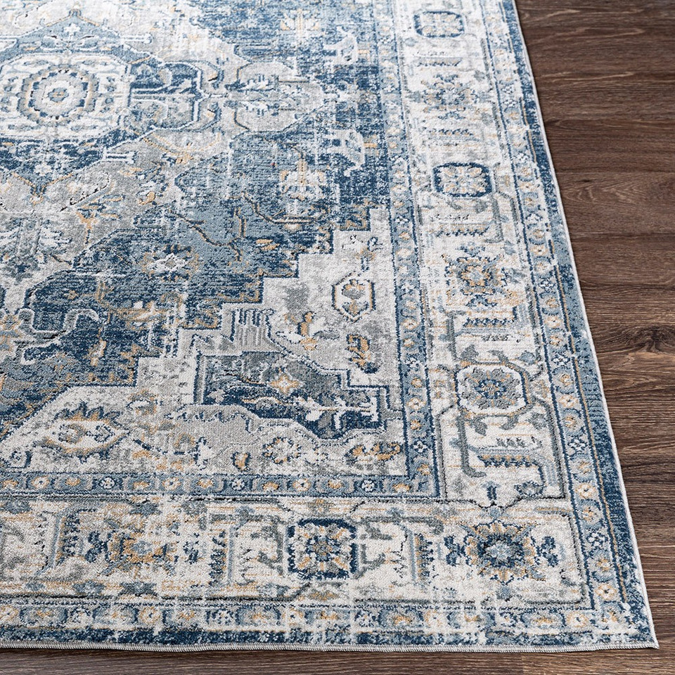 blue traditional rug closeup corner on wood floor