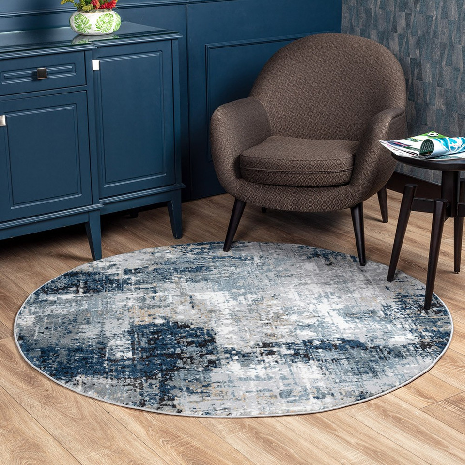 blue abstract rug in a room with matching decor