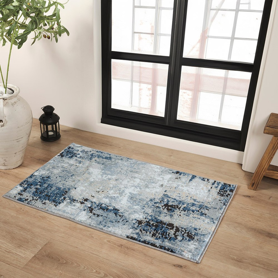 blue abstract rug in a room with matching decor