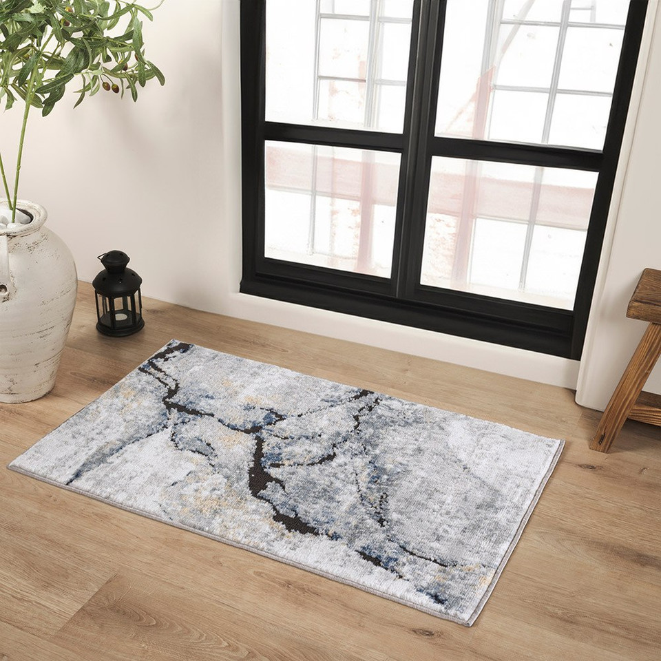 blue abstract rug in a room with matching decor