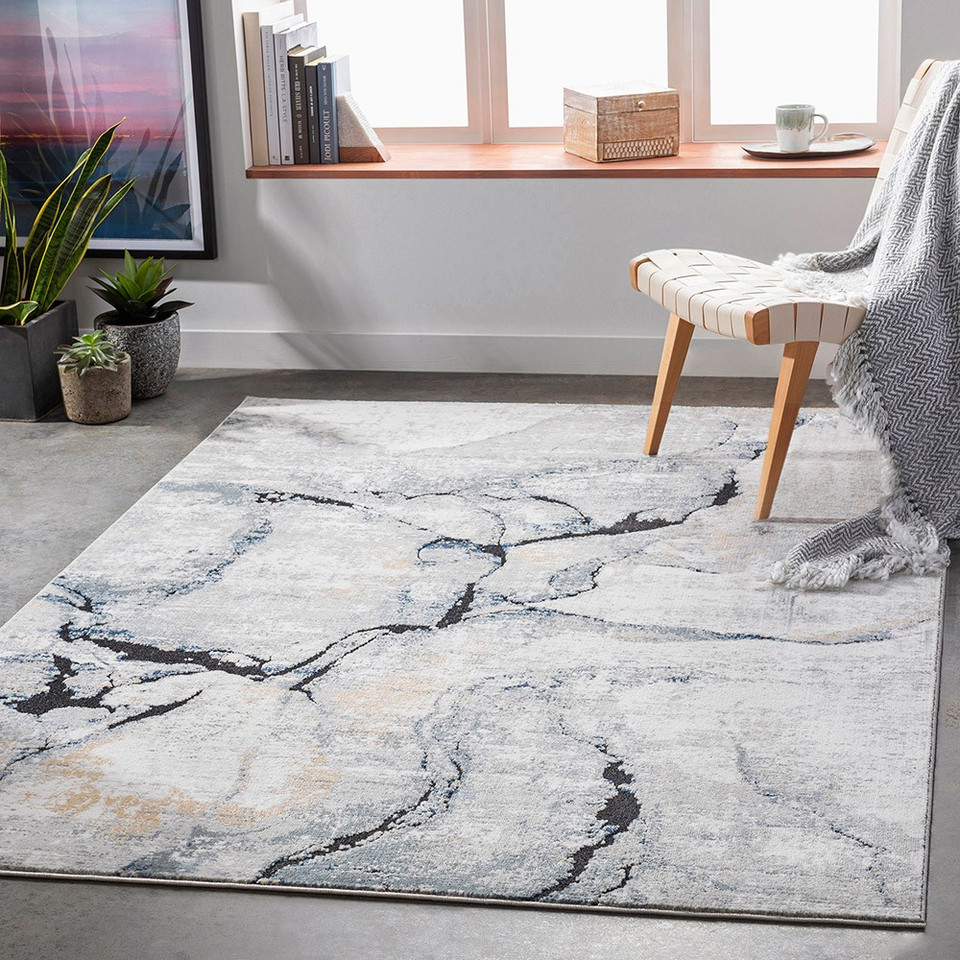 blue abstract rug in a room with matching decor