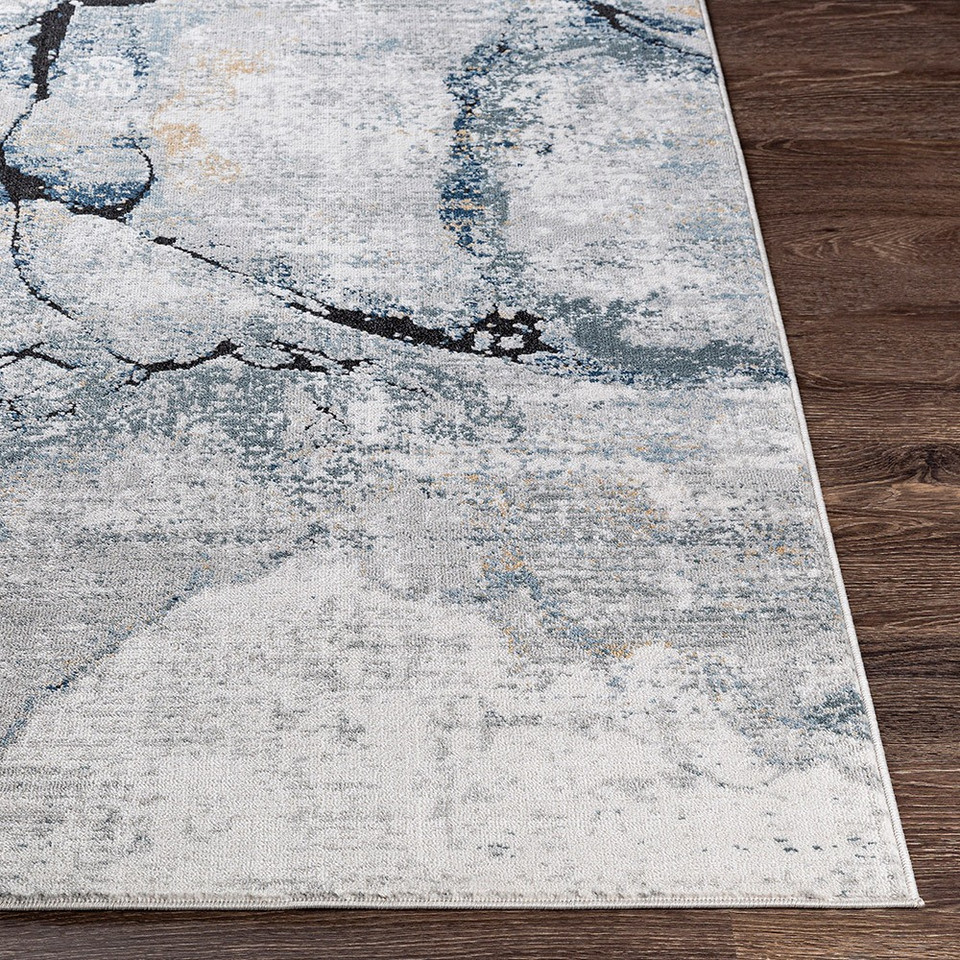blue abstract rug closeup corner on wood floor