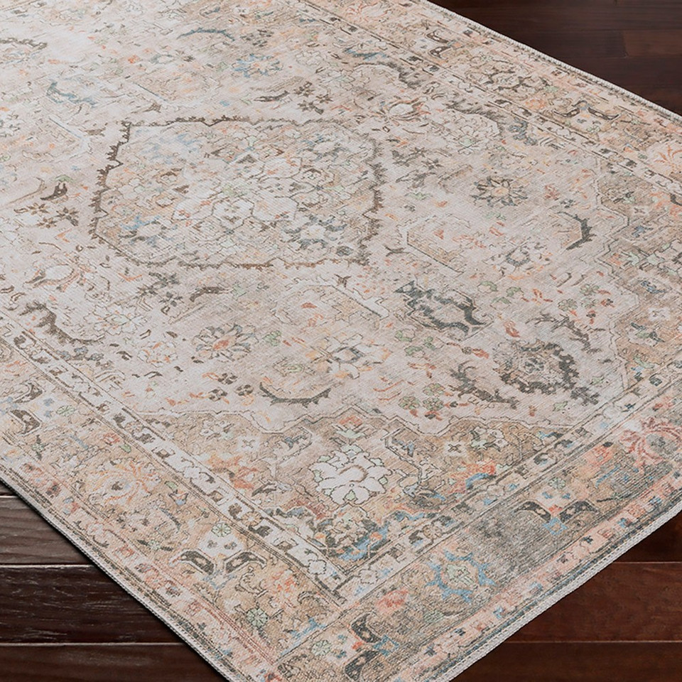 taupe traditional rug closeup corner on wood floor