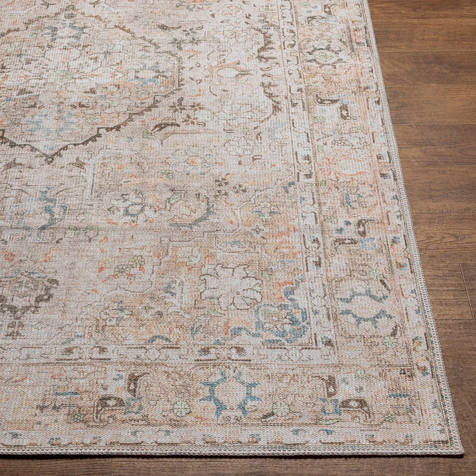 taupe traditional rug closeup corner on wood floor
