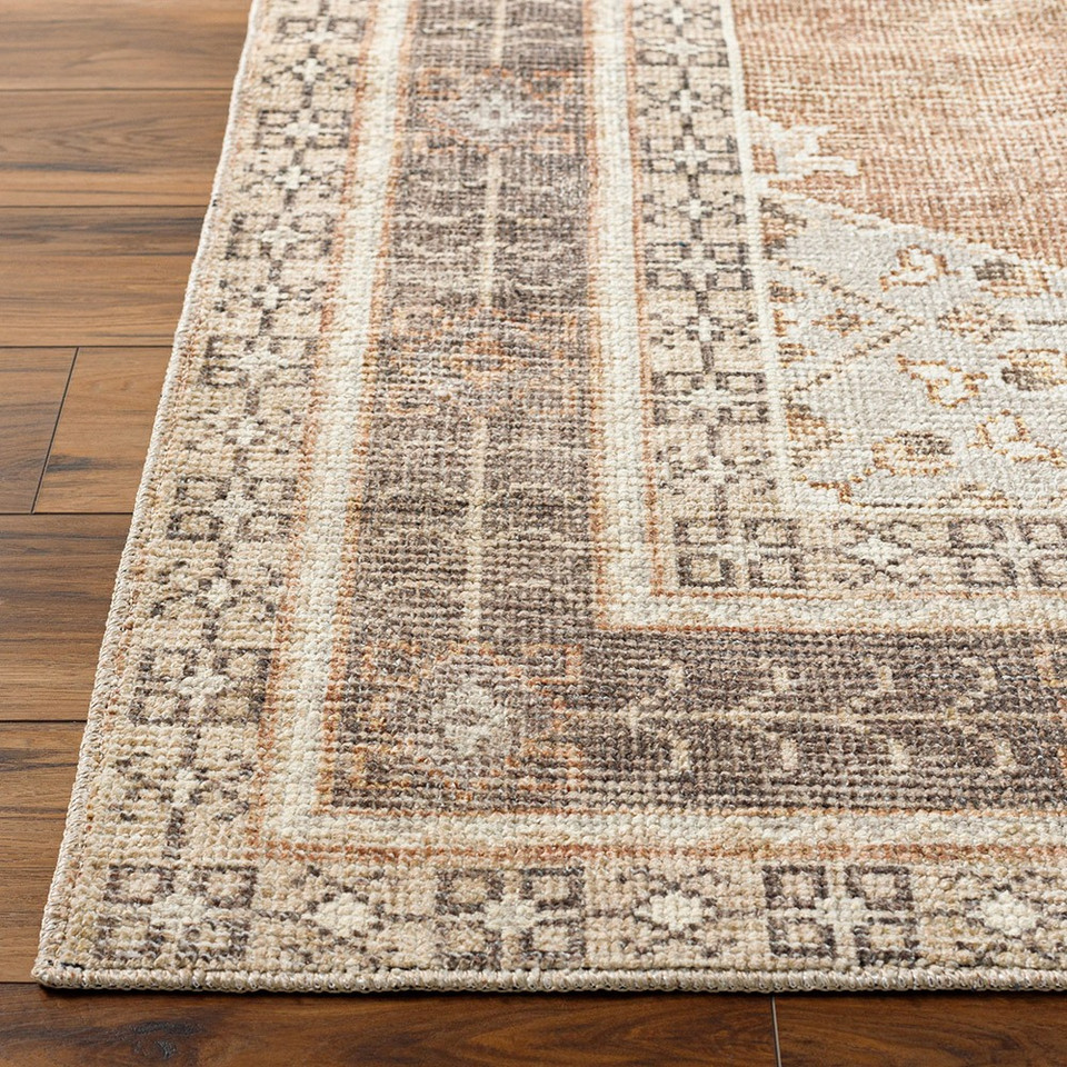 cinnamon traditional rug closeup corner on wood floor