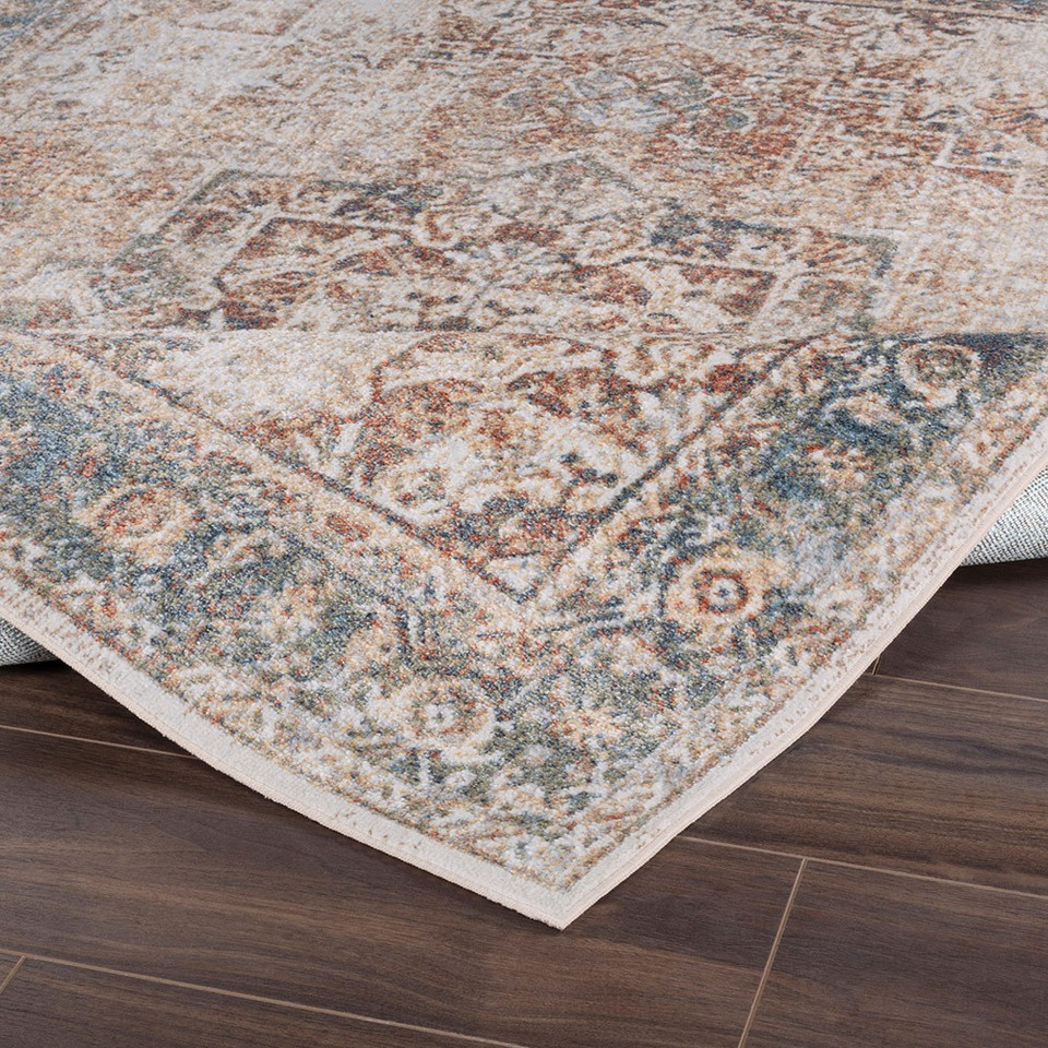 cinnamon traditional rug folded on wood floor