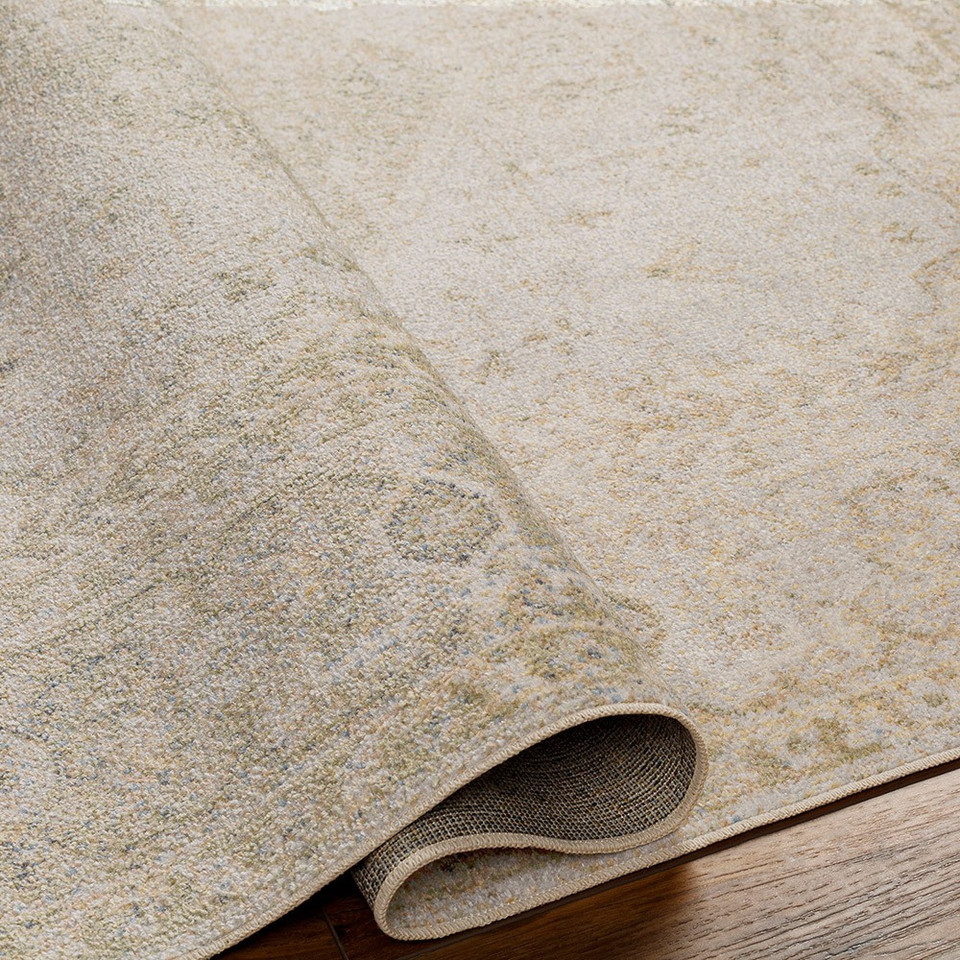 camel traditional rug folded on wood floor