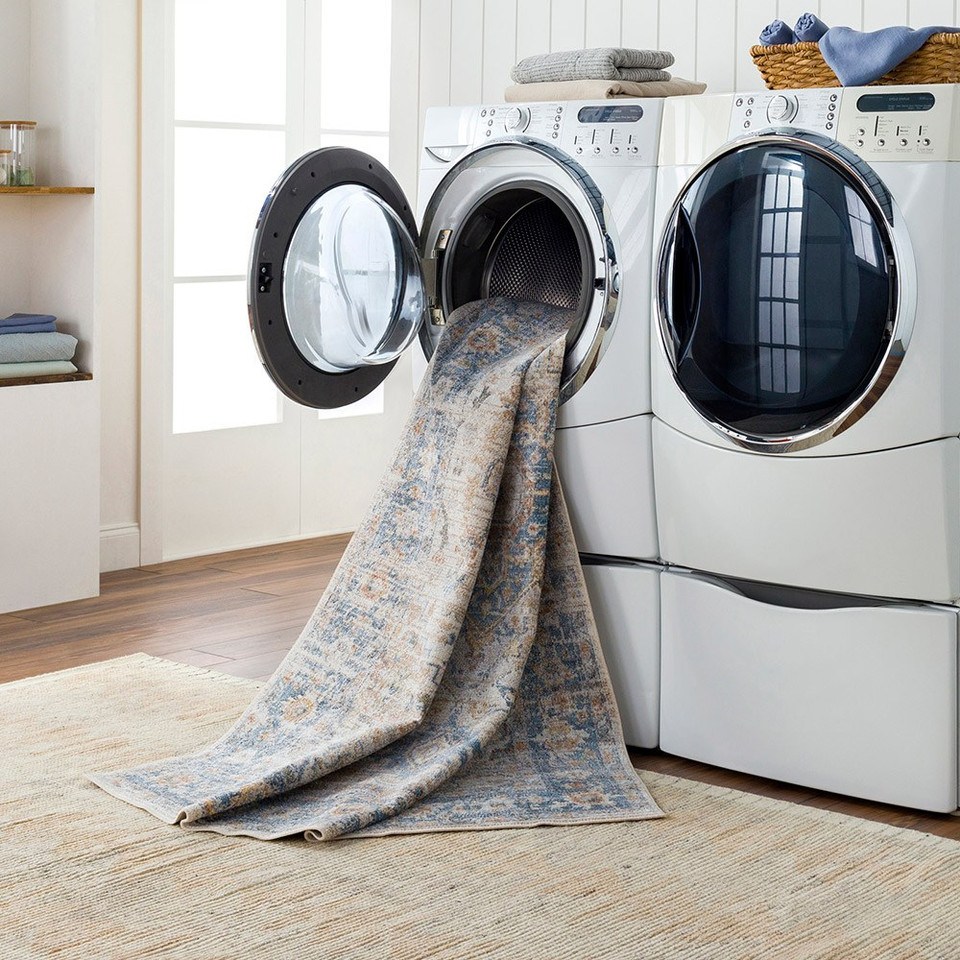 beige traditional rug in a washing machine
