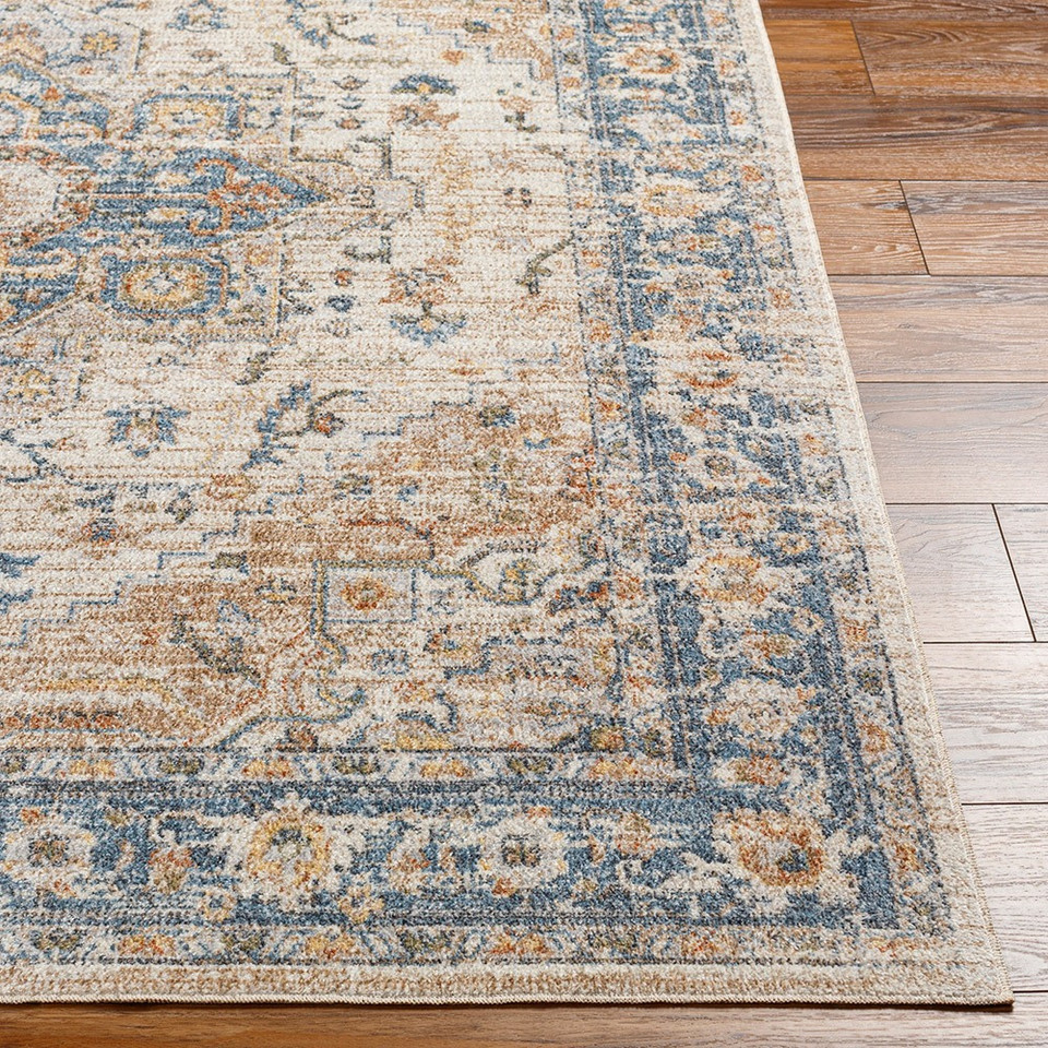 beige traditional rug closeup corner on wood floor