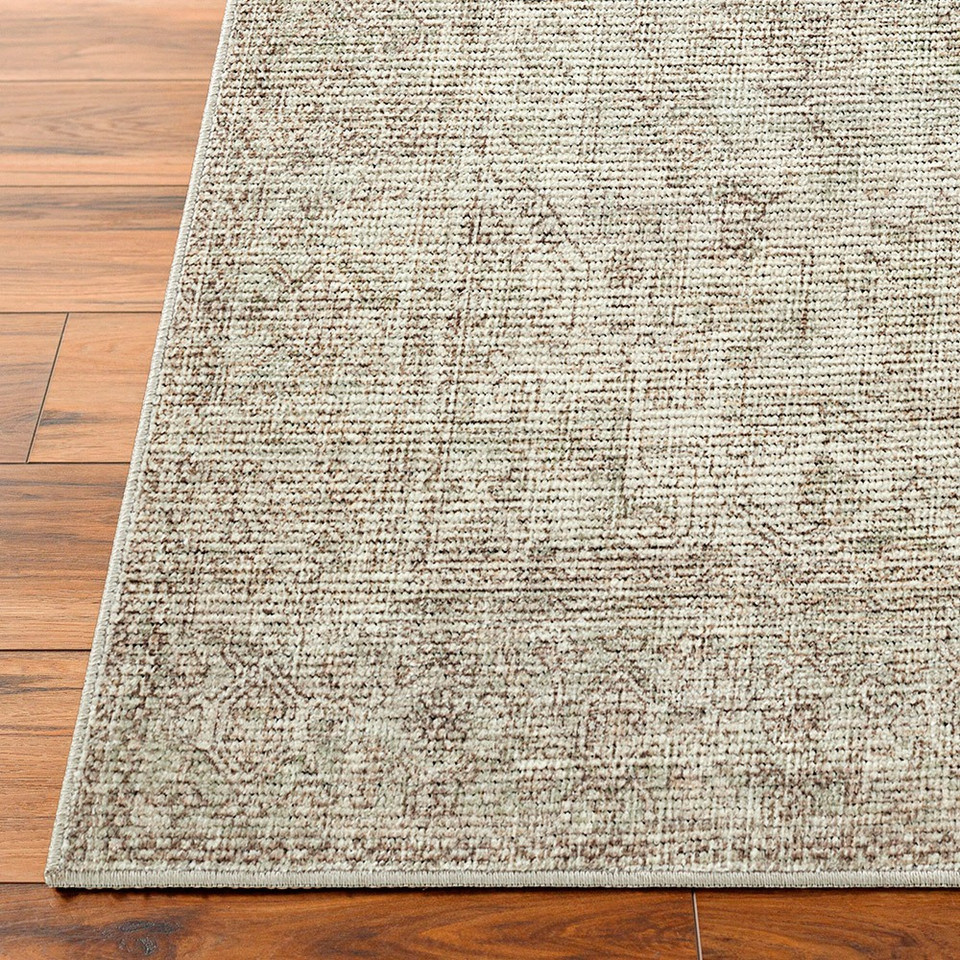 sage traditional rug closeup corner on wood floor