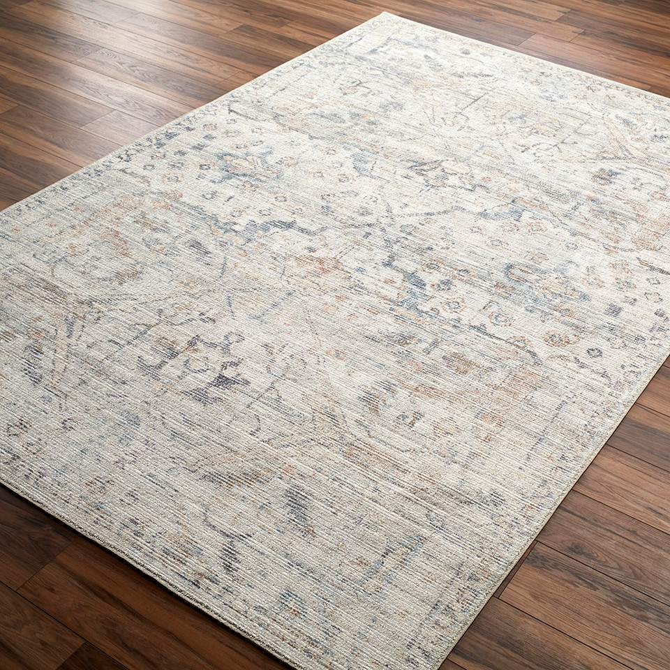 cream traditional rug closeup corner on wood floor