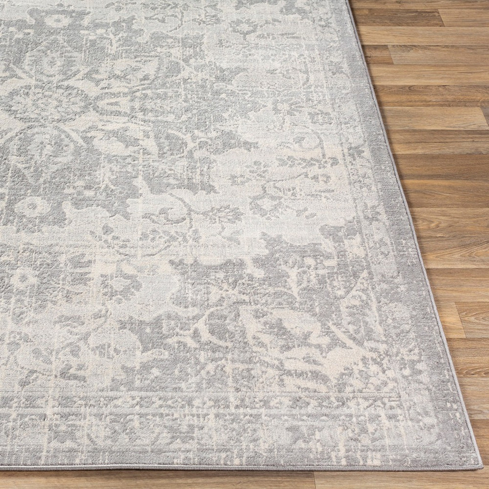 grey traditional rug closeup corner on wood floor