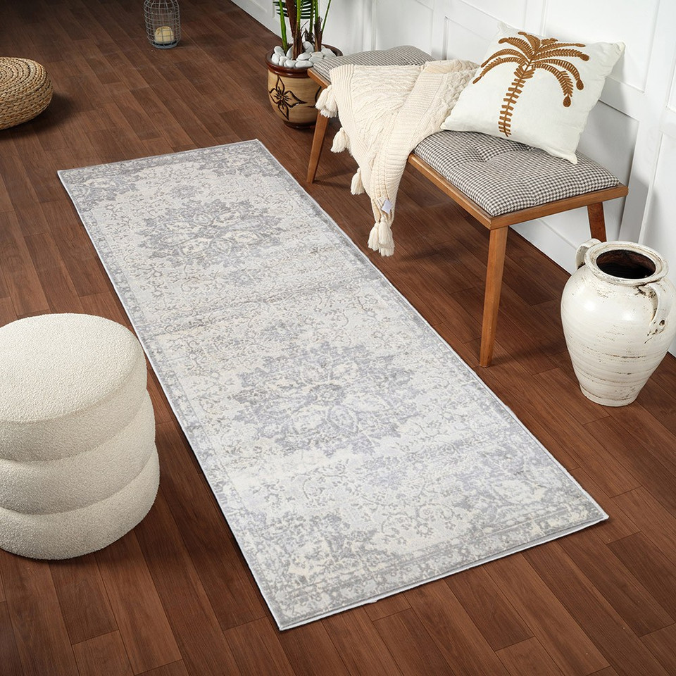 grey  traditional rug in a room with matching decor