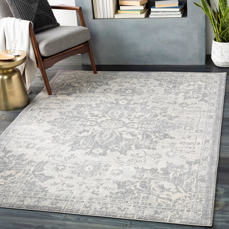 grey traditional rug in a room with matching decor