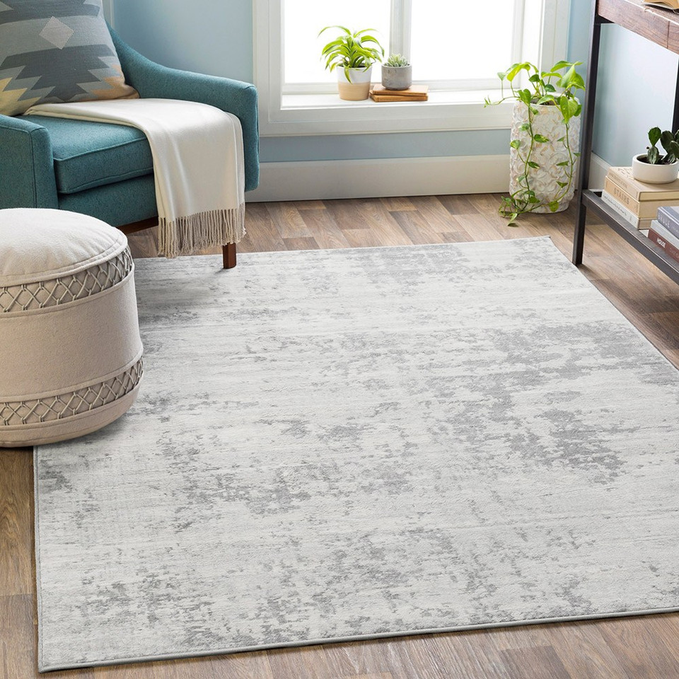 grey abstract rug in a room with matching decor