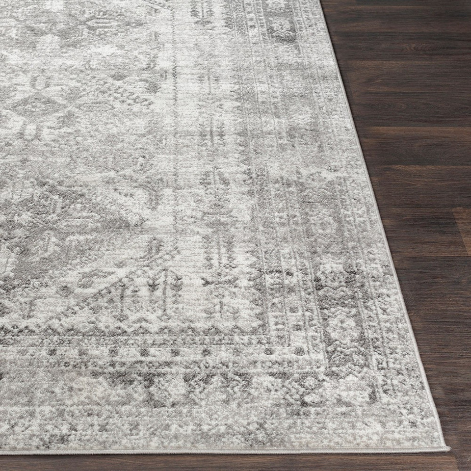 grey abstract rug closeup corner on wood floor