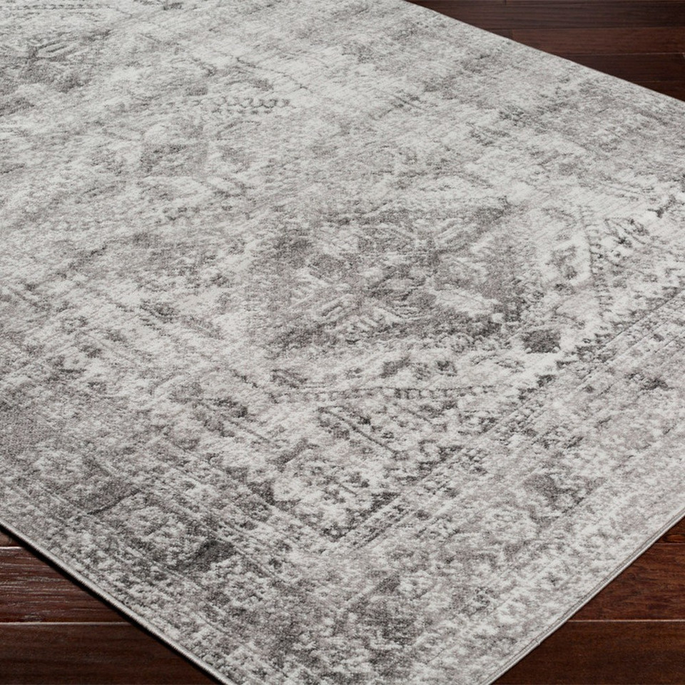 grey abstract rug closeup corner on wood floor