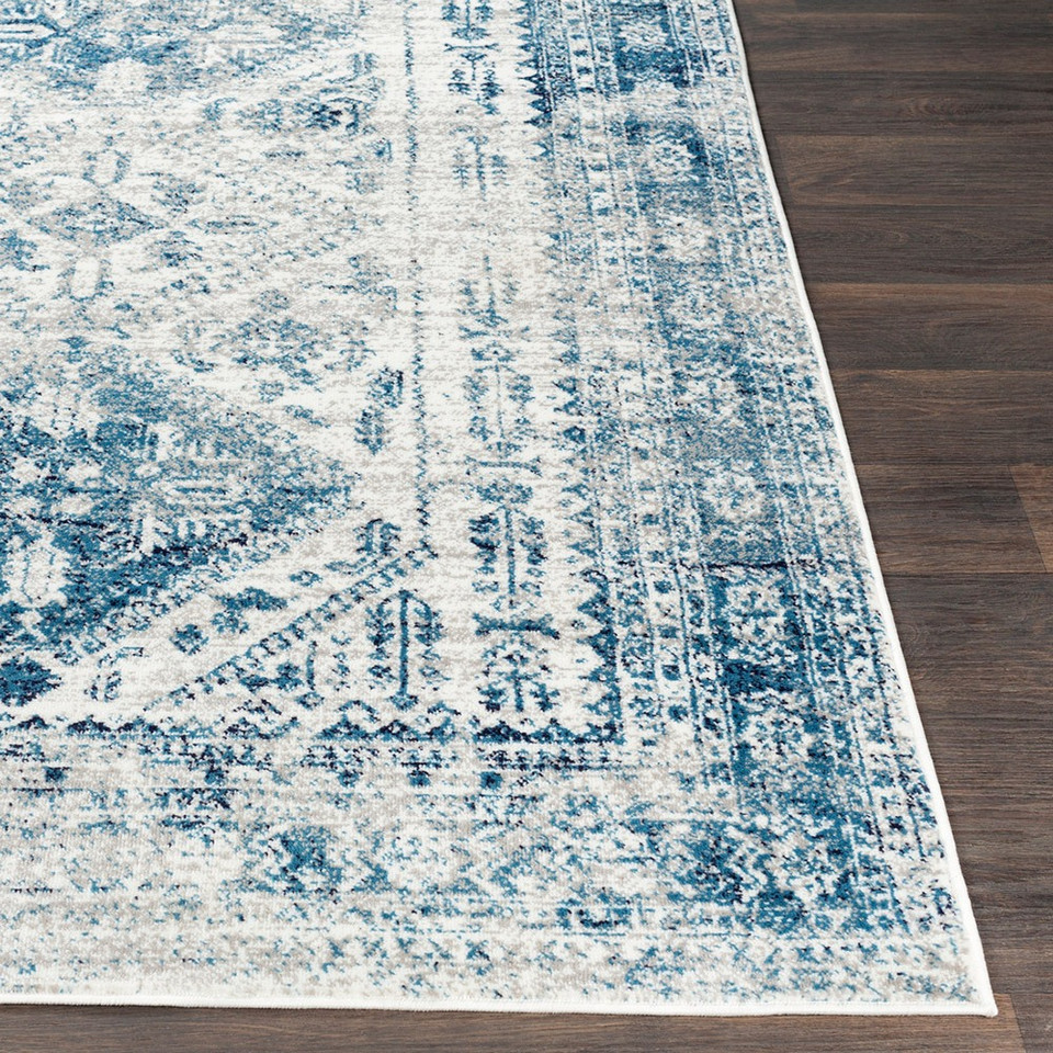 grey abstract rug closeup corner on wood floor