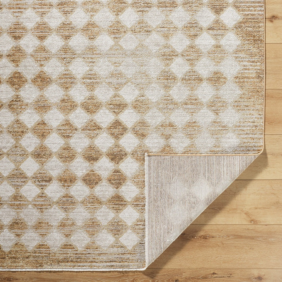 mustard geometric rug corner fold on wood floor