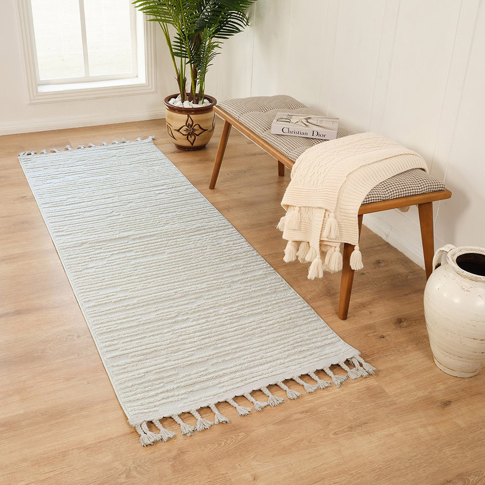 ivory berber geometric rug in a room with matching decor