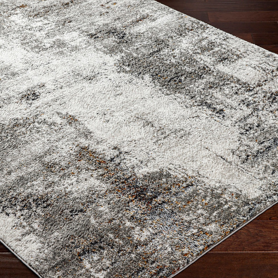 grey abstract rug closeup corner on wood floor