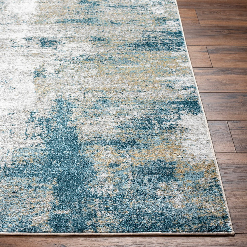 teal abstract rug closeup corner on wood floor