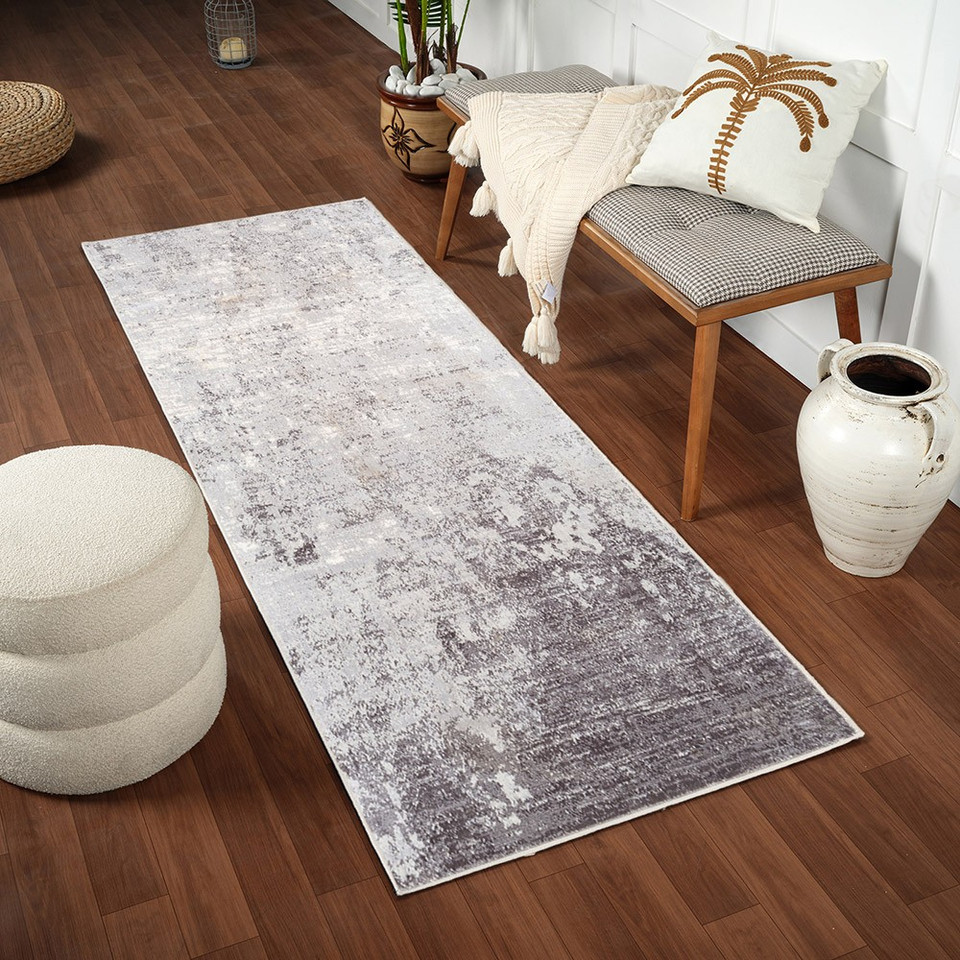 silver abstract rug in a room with matching decor