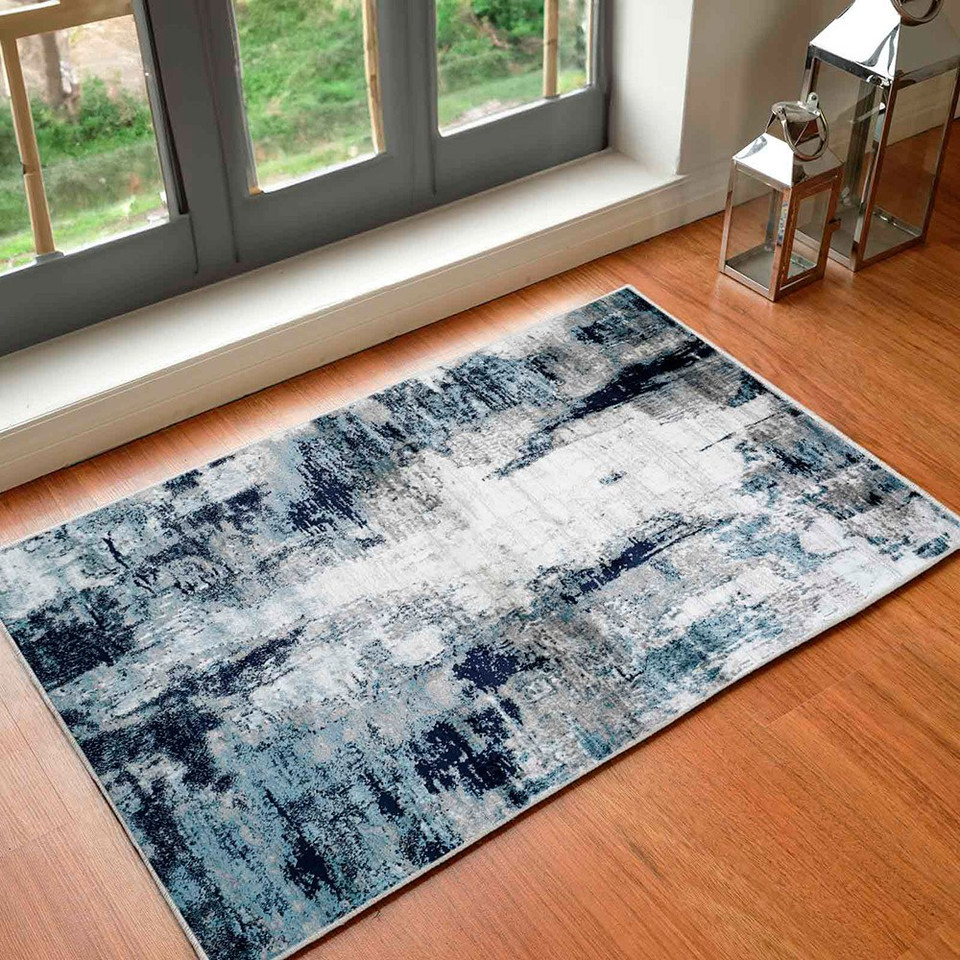 navy abstract rug in a room with matching decor