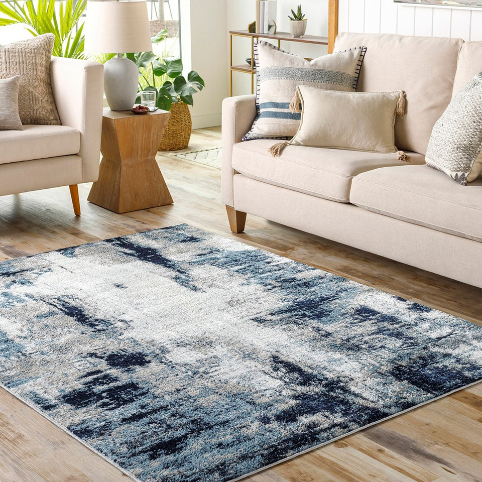 navy abstract rug in a room with matching decor